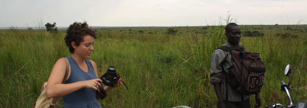 SU Local Coordinator Ben Ocan takes a break from driving American volunteers Kelly Curran to Amuru by motorcycle.