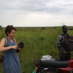 SU Local Coordinator Ben Ocan takes a break from driving American volunteers Kelly Curran to Amuru by motorcycle.